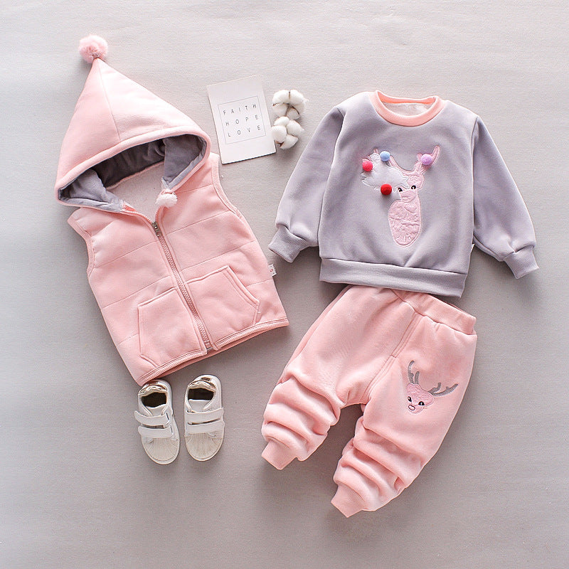 Children's pink and gray outfit with matching shoes on a light gray background