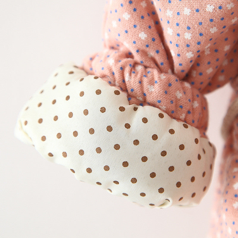 Close-up of polka dot fabric with a plain background