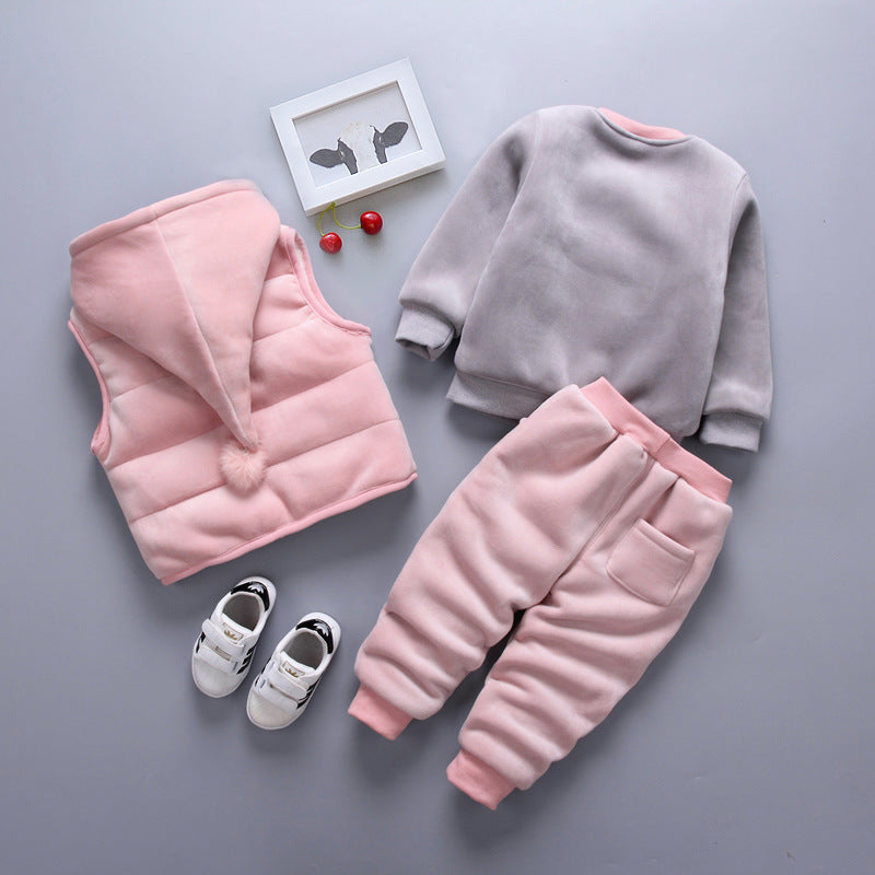 Children's pink and gray outfit with a vest, sweatshirt, and pants on a gray background.