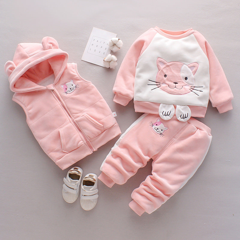 Pink baby outfit with cat design on a gray background